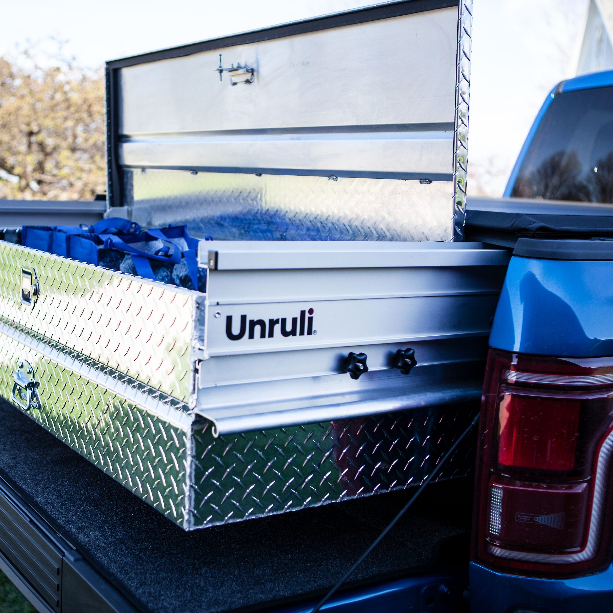 pickup truck with tonneau and toolbox with bags inside